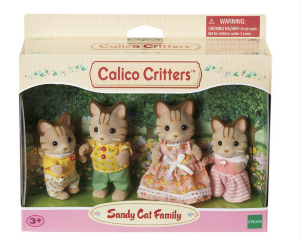 Sandy Cat Family Calico Critters in their box. Through the clear plastic window you can see all four critters and their adorable outfits. 