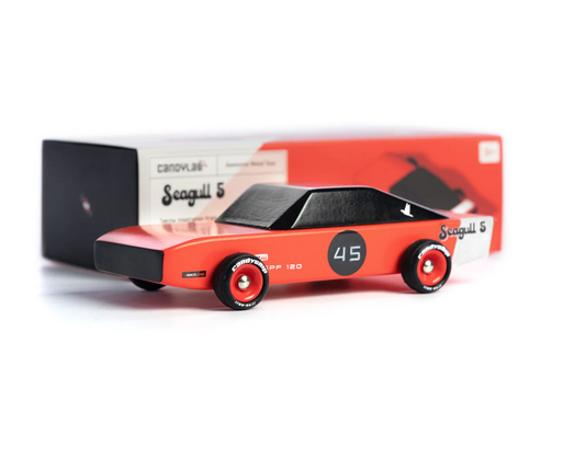 Super cool 70's inspired red and black muscle car viewed from the side and in front of it's keepsake box. 