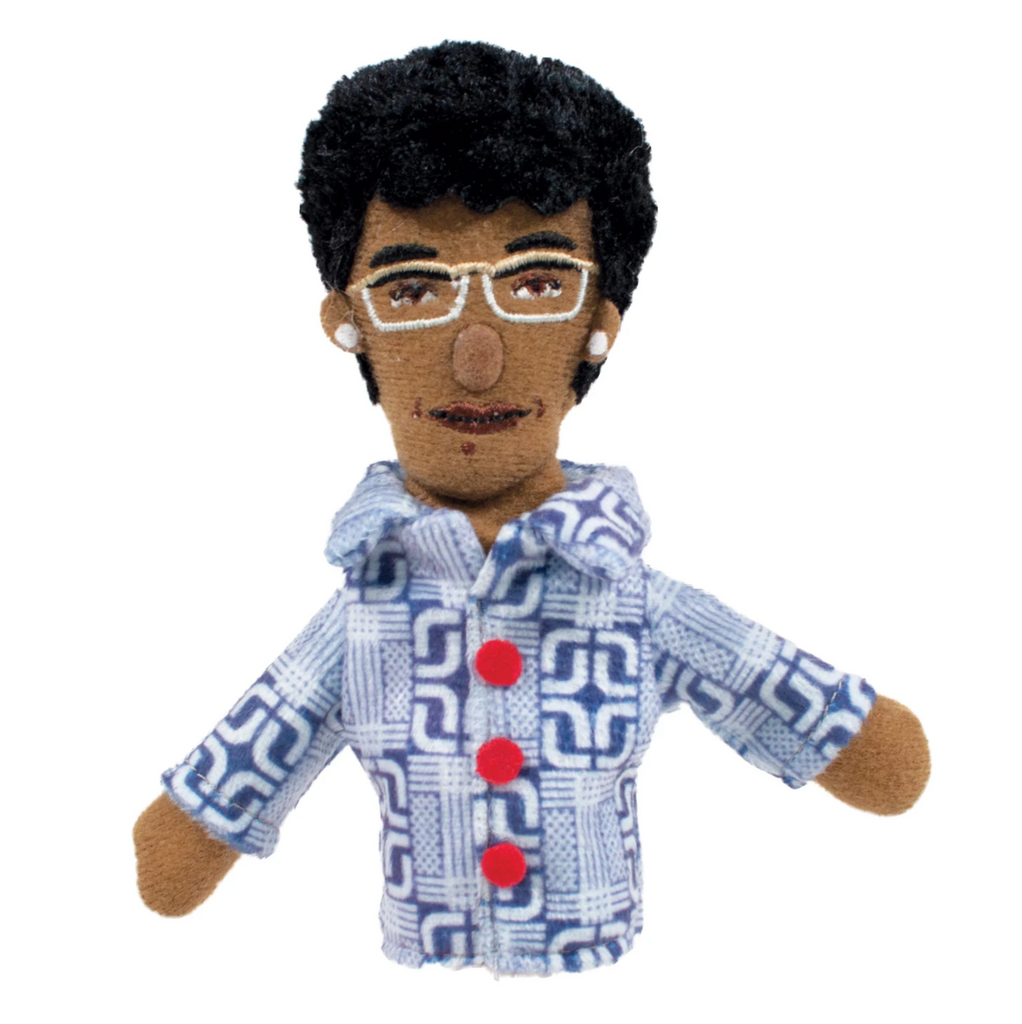 Finger puppet of Shirley Chisholm in a blue and white print shirt with red buttons.
