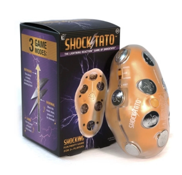The Shocktato box and an actual Shocktato leaning against it. The Shocktato looks like a plastic potato with silver sensors in random spots that undoubtedly provide the shock!