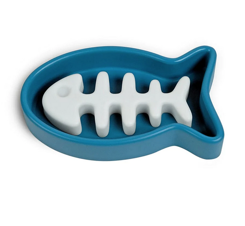Fish shaped blue bowl with fish skeleton inside that keeps food in various compartments. 