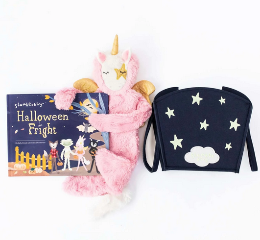 Unicorn Pegasus Snuggler with her Boo basket and hardcover book Halloween Fright. 