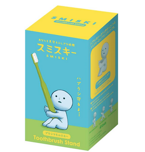 Smiski Protecting Toothbrush Stand. Smiski is in a sitting position and holds your toothbrush.  Smiski is made of a big round head on a body. SMISKI is made of phosphorescent material that absorbs light and makes product glow in the dark.