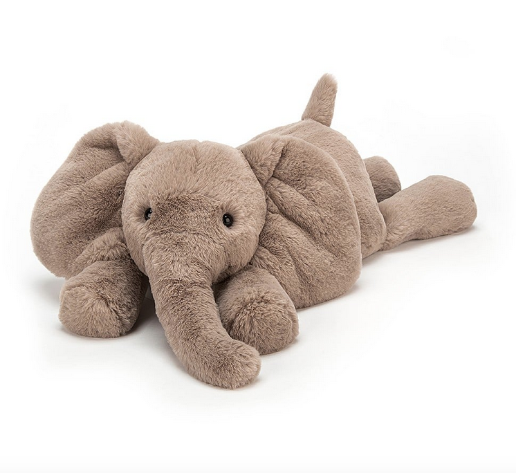 Smudge Elephant plush splayed out on their belly ready for a nap. 