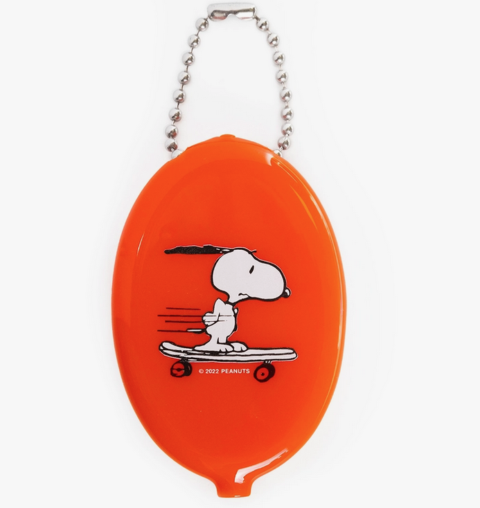 Orange coin purse with illustration of Snoopy riding a skateboard. 