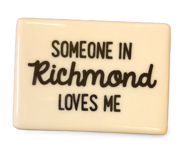 White rectangle ceramic magnet that reads Someone in Richmond Loves Me in black text.