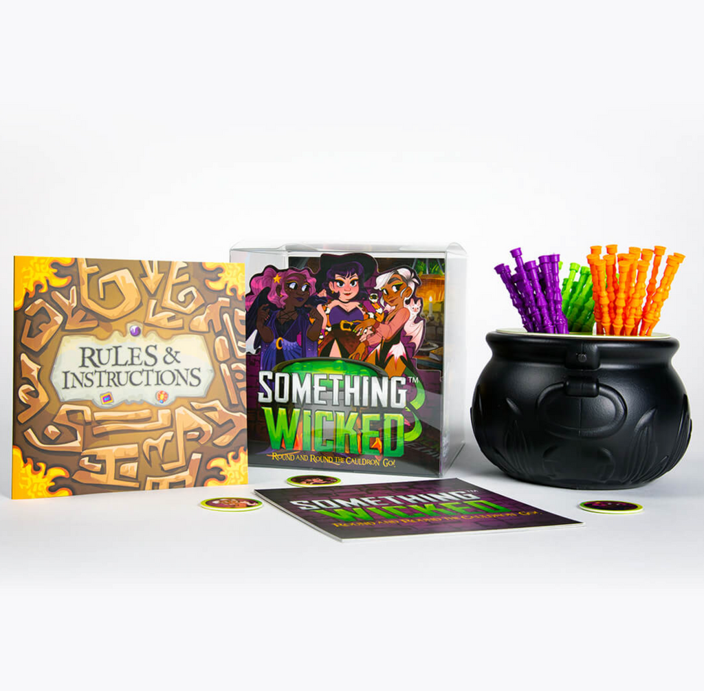 Something Wicked instructions, box, and cauldron with game wands.