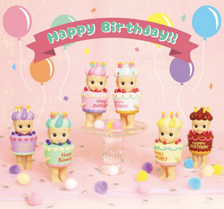 Sonny Angel Birthday Gift series blind box. Sonny Angel is dressed in various happy birthday cakes topped with a hat of a dollop of icing and candles. Sonny Angels resemble old fashioned Kewpie dolls.
