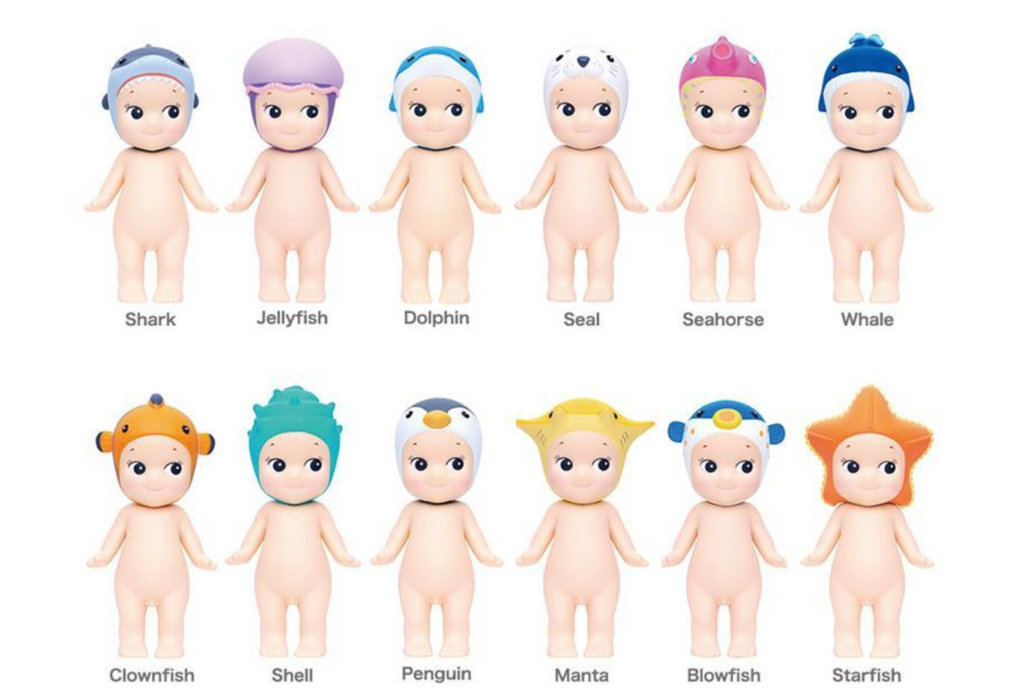 Sonny Angel Marine Series. Sonny Angels are blind box collectibles soft vinyl figures of a nude kewpie style doll with different hats, like a shark, jellyfish, seahorse, or manta ray.