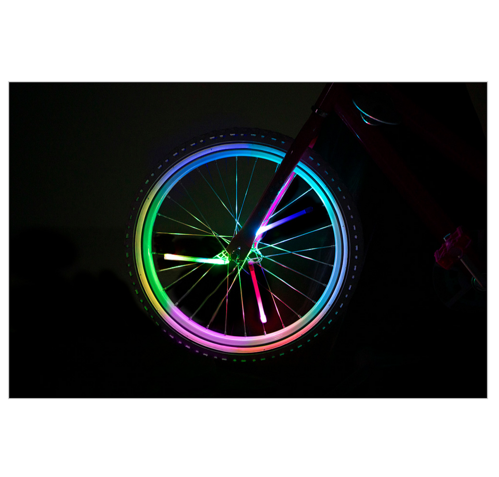 SpinBrightz color morph bike spoke lights on a wheel in the dark.
