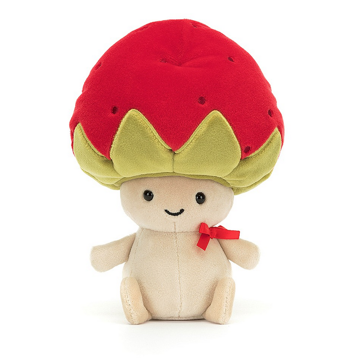 Little plush critter wearing a red ribbon around it's neck with a big red strawberry hat. 