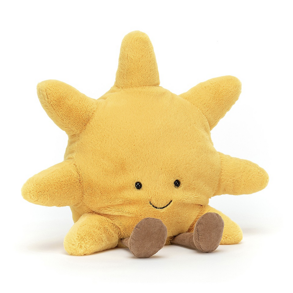 View of the front of the Amuseable plush Sun. Golden yellow plush with a smiling face and light tan feet. 