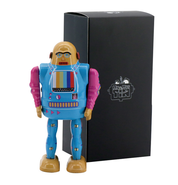 TV Bot tin toy standing in front of black box. 