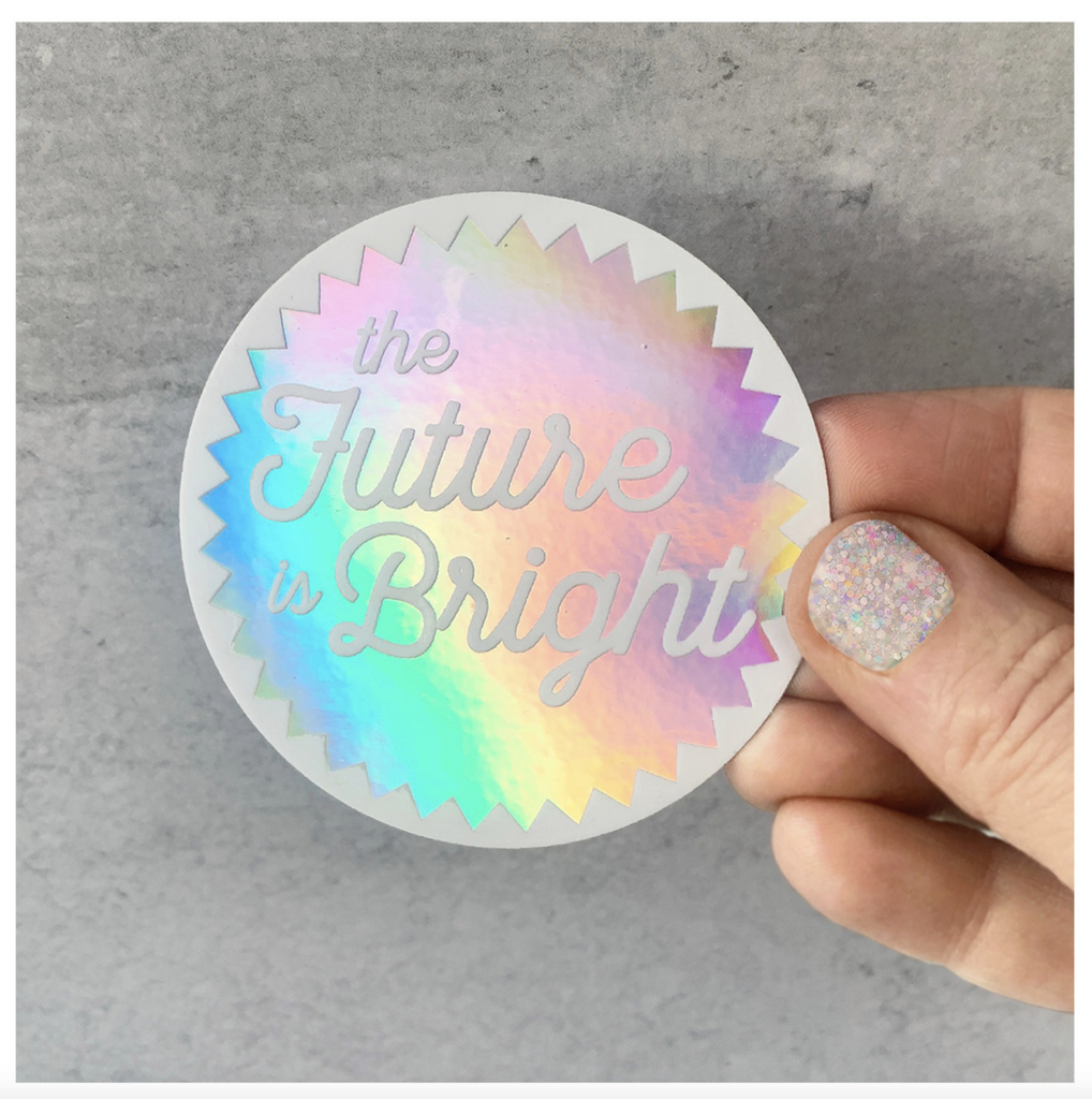 Round holographic sticker that reads "The Future is Bright" in white text.