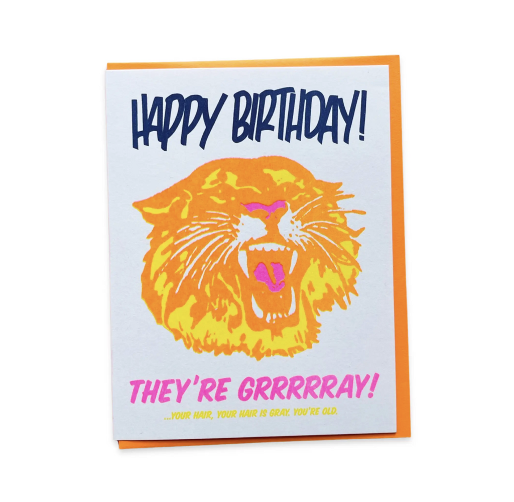 Letterpress greeting card with a neon yellow and orange roaring tiger head that reads Happy birthday! They're Grrrrray! Your hair, your hair is gray, you're old.