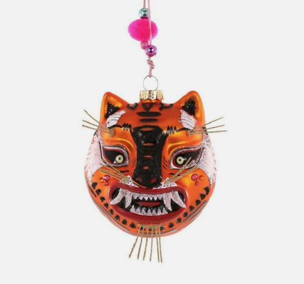 Tibetan Tiger head glass ornament with glittered fangs and vibrant eyes. 