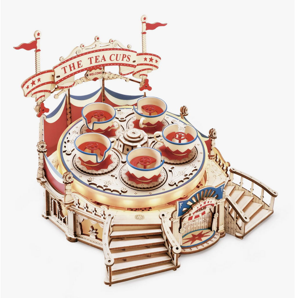 Wooden do it yourself amusement park ride Tilt-a-whirl electro-mechanical puzzle. Once built, it is natural wood with details of red and blue. Spinning surface tilts and lights up with LED lights.