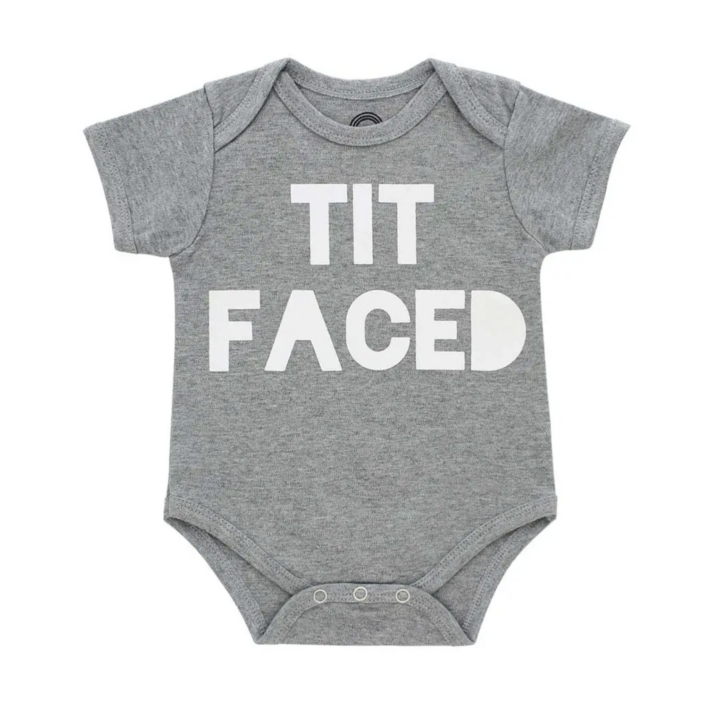Grey onesie in a size 3 to 6 months. White text reads Tit Faced.