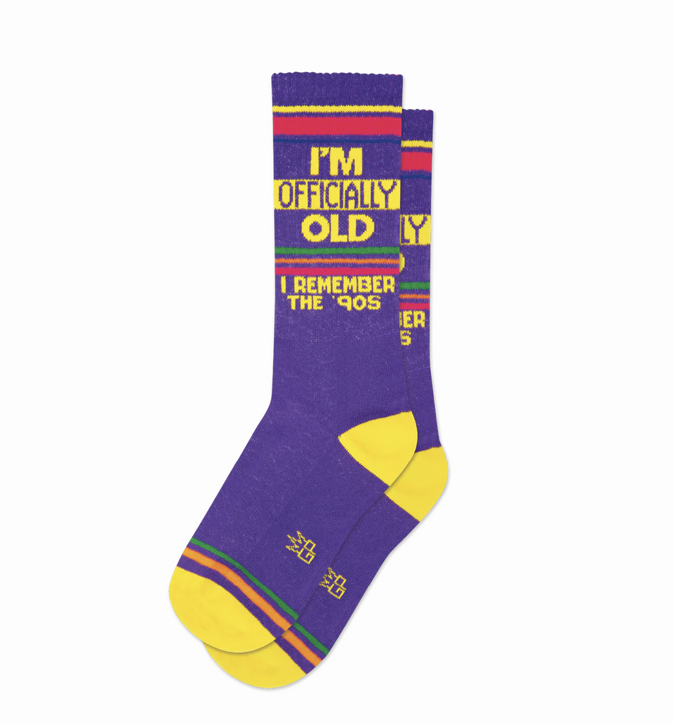 I'm Officially Old I Remember the 90's Socks. These super-comfy, unisex, one-size-fits-most, Gym Socks are made in the USA of Purple Cotton with accents of Fuschia Nylon, Neon Orange Nylon, Libby Yellow Nylon, Kelly Green Nylon, Royal Blue Nylon. 