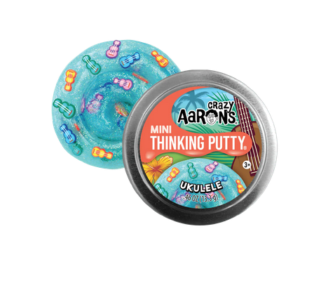 Mini Thinking Putty in a round tin. Sparkly turquoise blue putty with multicolored ukulele clay pieces.