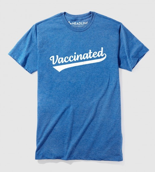 Blue tshirt says Vaccinated in white.