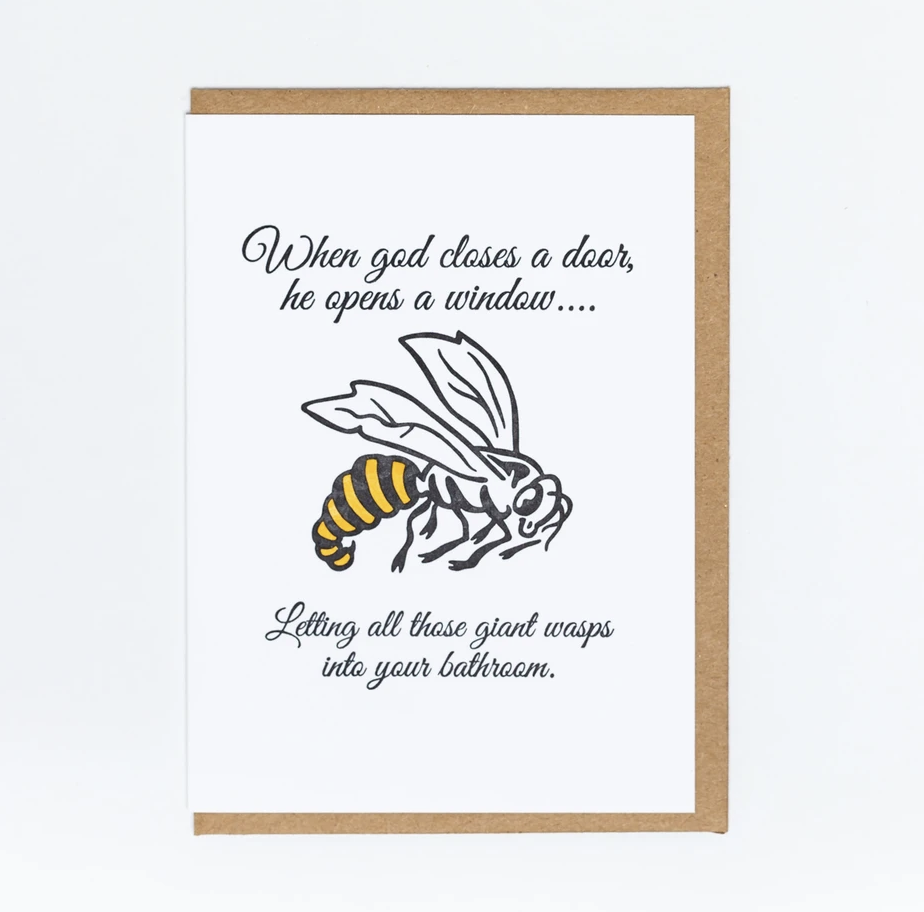 Letterpress card of a wasp that reads "When god closes a door, he opens a window...Letting all those giant wasps into your bathroom" in black.
