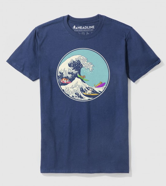 Blue shirt with a circular illustration of dogs surfing big waves.