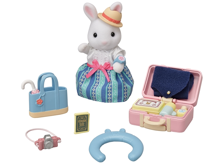 Snow Rabbit mother Emilia in an exclusive outfit, plus a suitcase, handbag, neck pillow, and travel accessories.