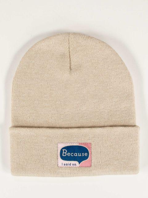 Off white cream knit beanie with Because I Said So tag in pink and light pink with a blue word bubble. 