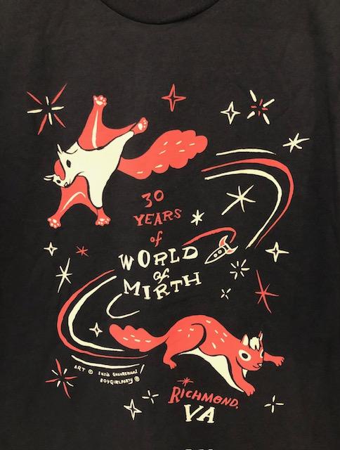 Dark grey unisex t shirt with orange pink flying squirrel and squirrel illustration. Reads 30 Years of World of Mirth, Richmond, VA.