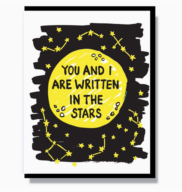 Card that has a black background with yellow constellations and a big yellow moon that reads "You And I Are Written In The Stars" 
