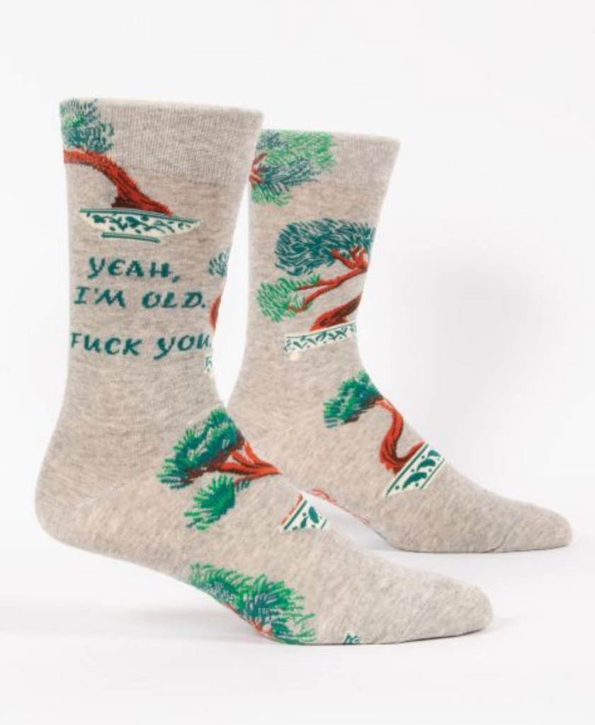 Oatmeal colored socks with bonsai trees in dishes. Green text reads Yeah, I'm old. Fuck you.